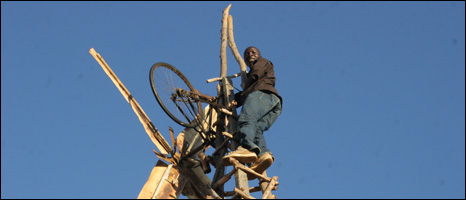 William Kamkwamba up one of his windmills