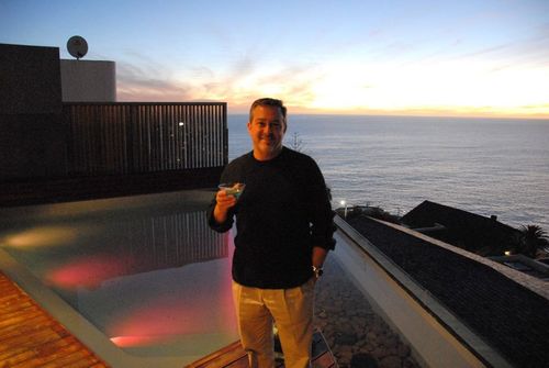 Dan shine capetown wef sunset by the pool with martini
